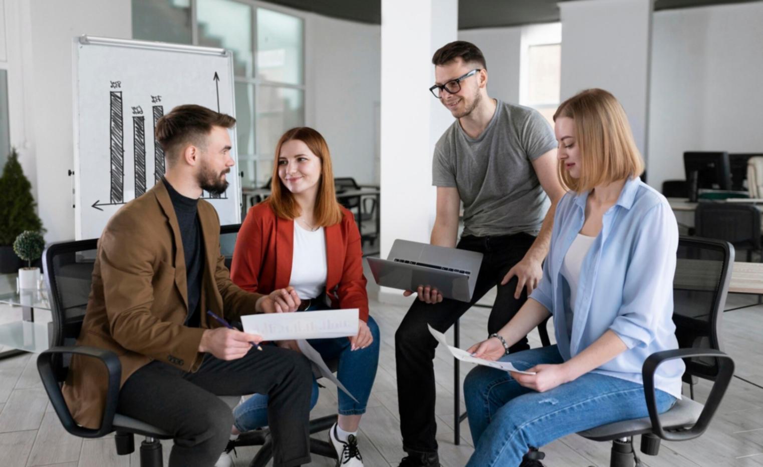 Financial professionals reviewing presentation materials and charts in a modern office setting
